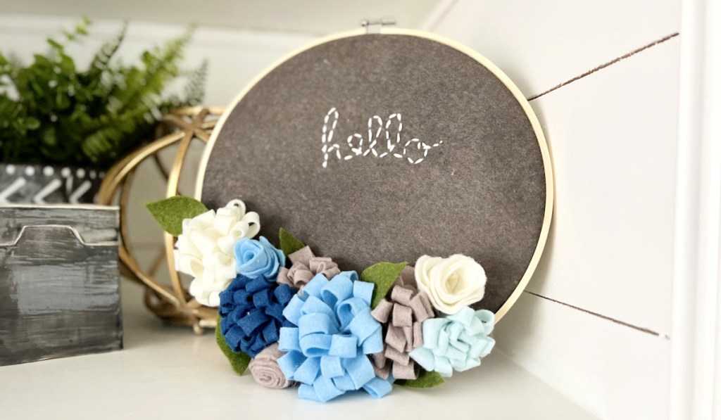 embroidery hoop craft displayed on shelf