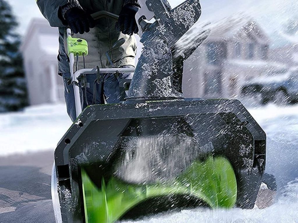 person using Greenworks snowblower