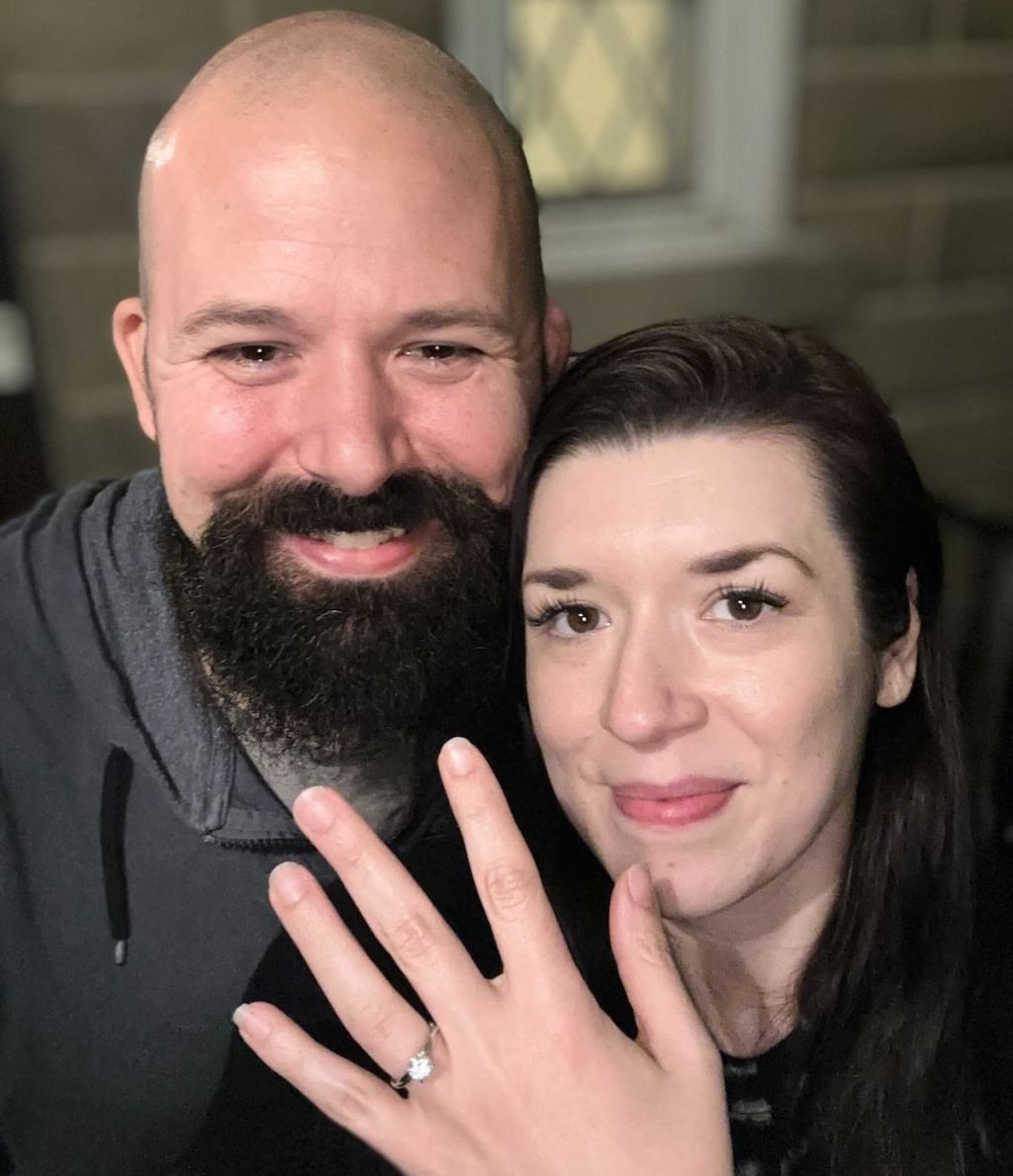 couple engaged and showing off ring