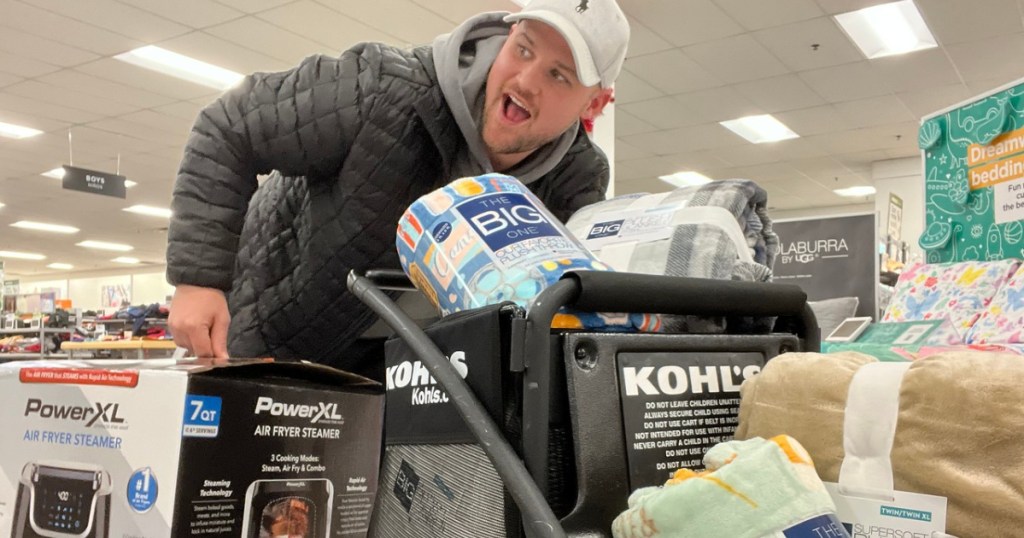 man with lots of store merchandise