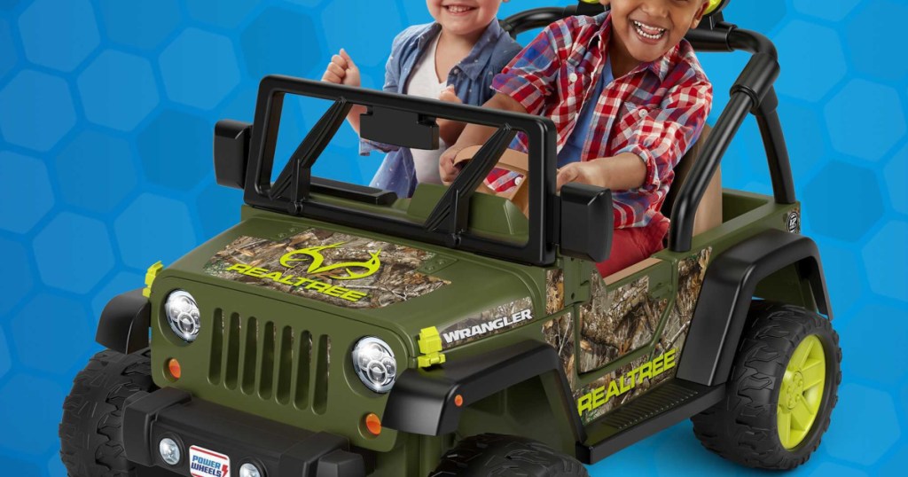 kids sitting onpower wheels ride on jeep