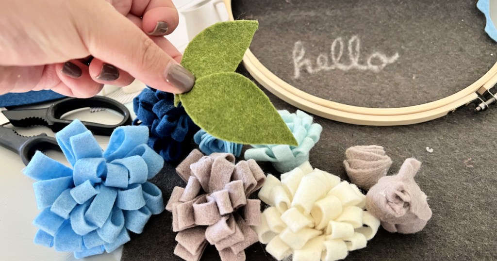 woman creating felt flowers