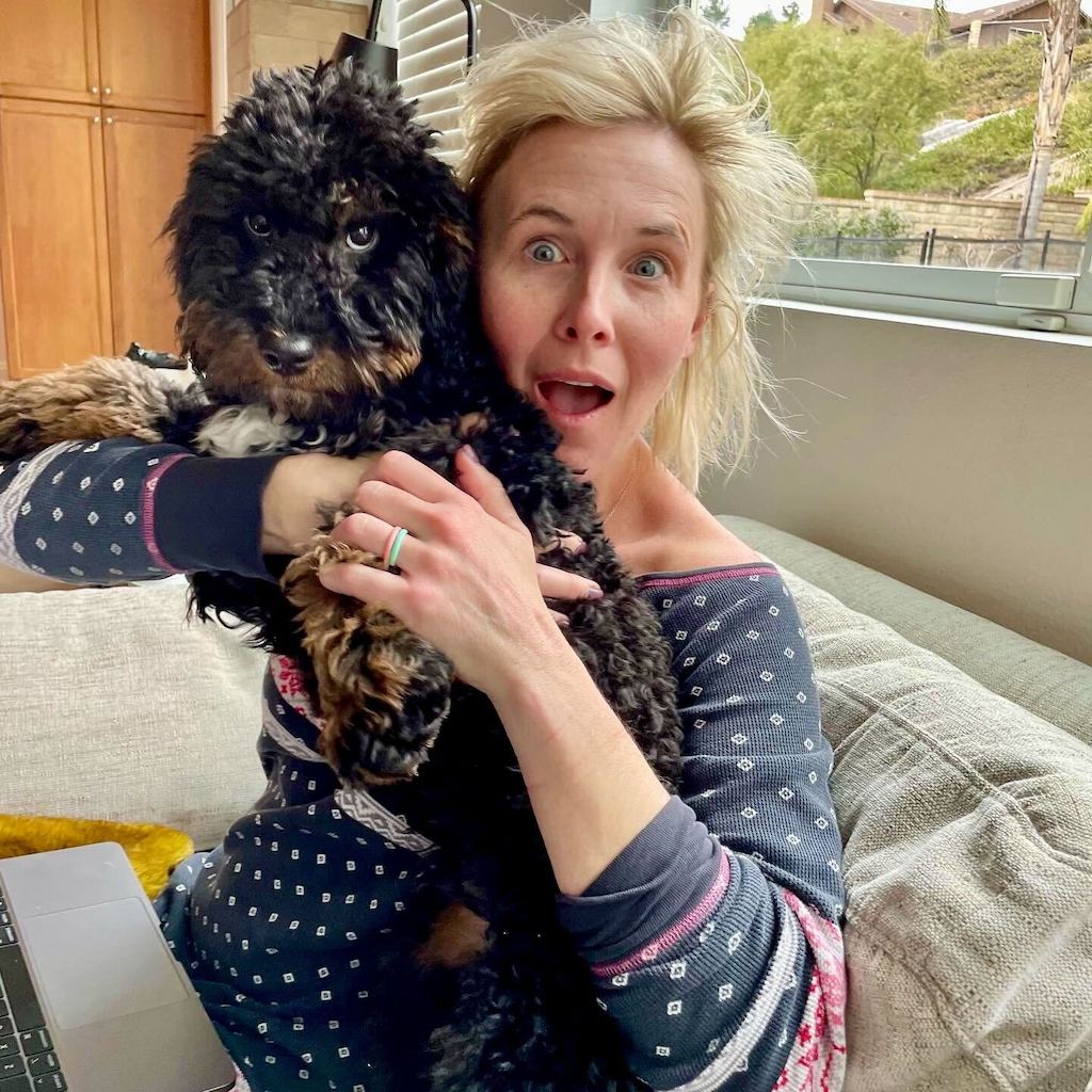 woman holding puppy 