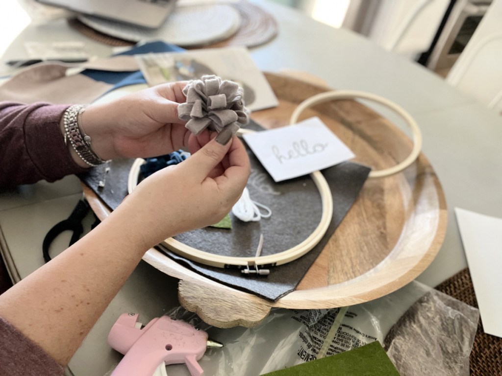 woman making a felt flower