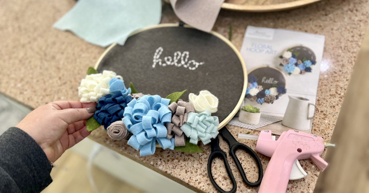 woman making an annie's craft floral hoop