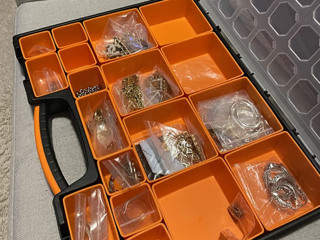 plastic box with orange compartments inside