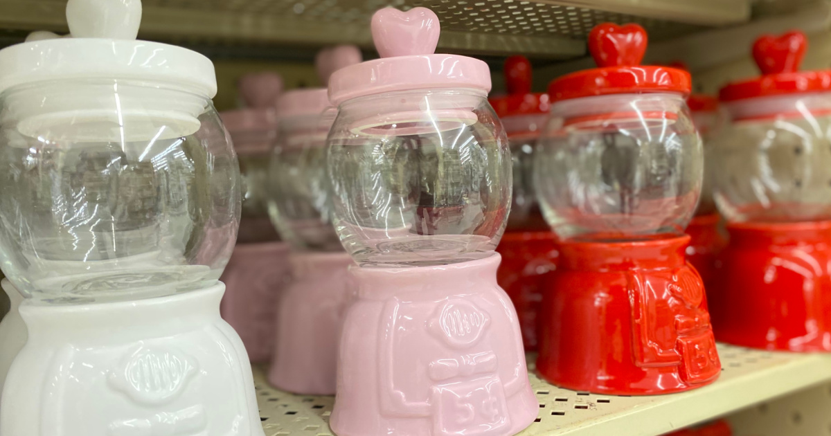 white, pink, and red Valentine's Day gumball machines on store shelf