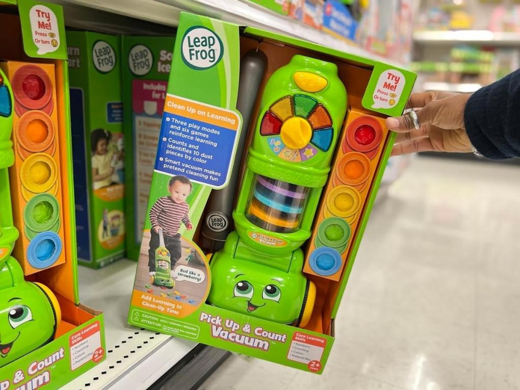 hand holding leapfrog vacuum in store