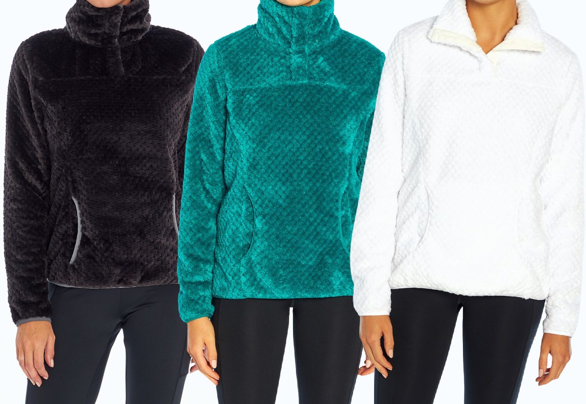 woman in black pullover, woman in teal pullover, and woman in white pullover