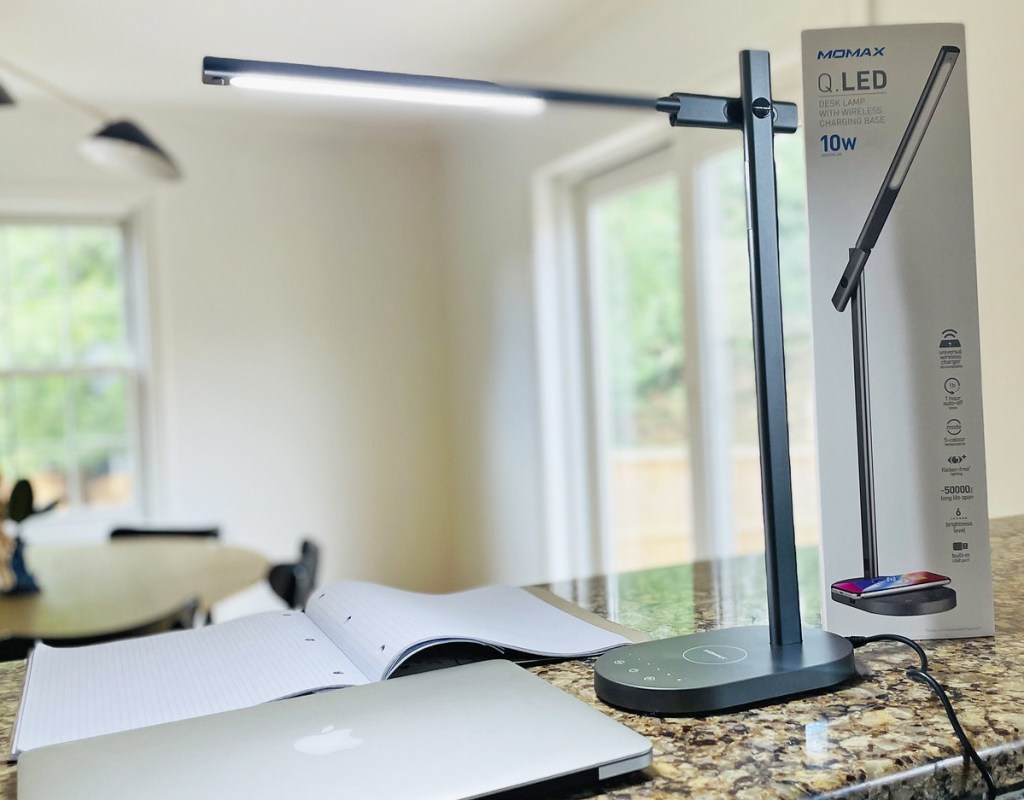 lamp on kitchen counter shining over notebook