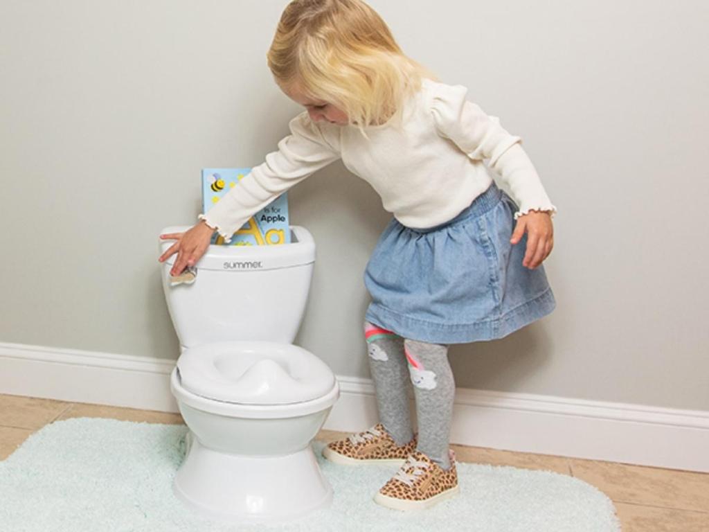 little girl with summer infant my size potty trainer potty