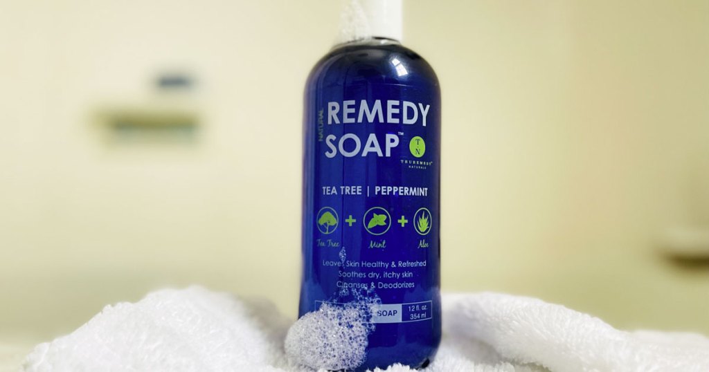 blue bottle of body wash in bathroom