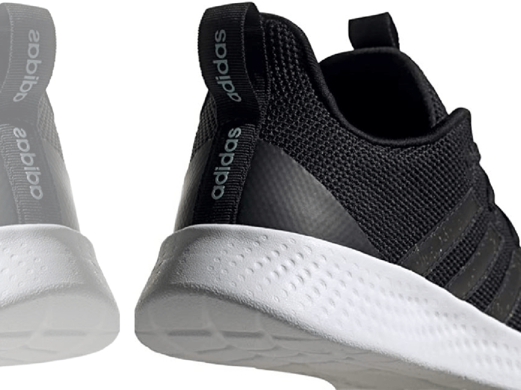 back of black shoe showing "adidas" logo