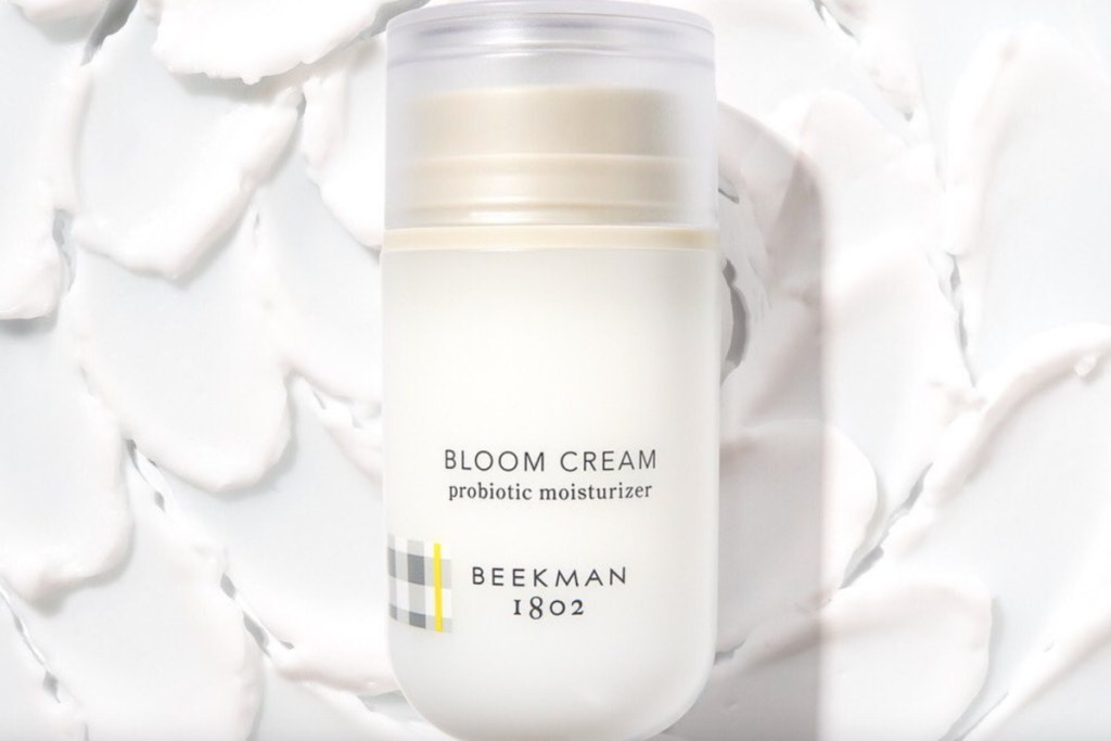 beekman 1802 moisturizer against cream background