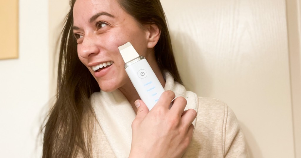 woman using face spatula on face