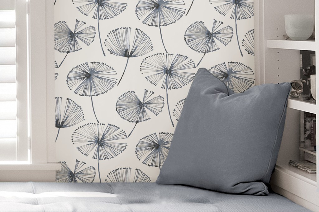 floral wallpaper behind bed