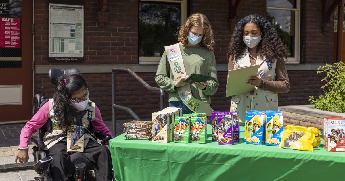 Girl Scouts selling cookies