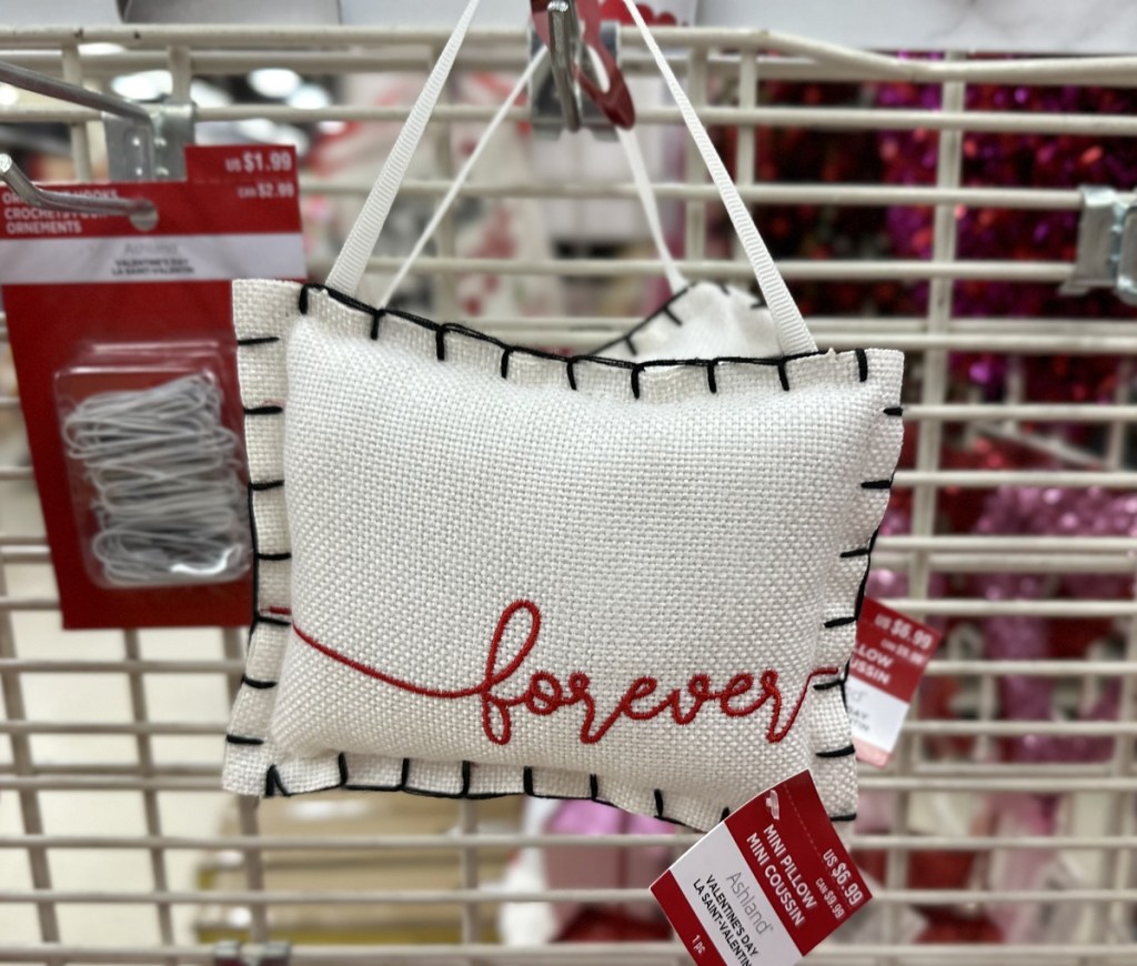 mini white pillow that says forever in red