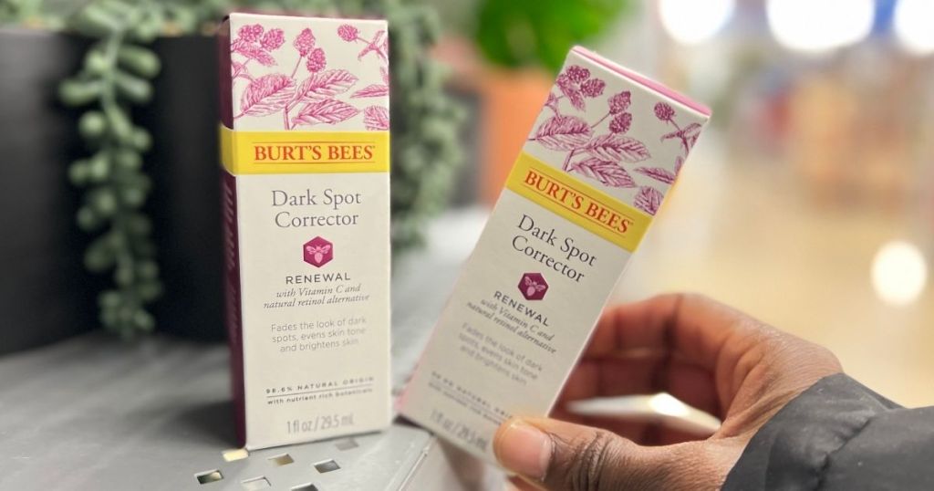 hand holding a Burt's Bees Renewal Dark Spot Corrector