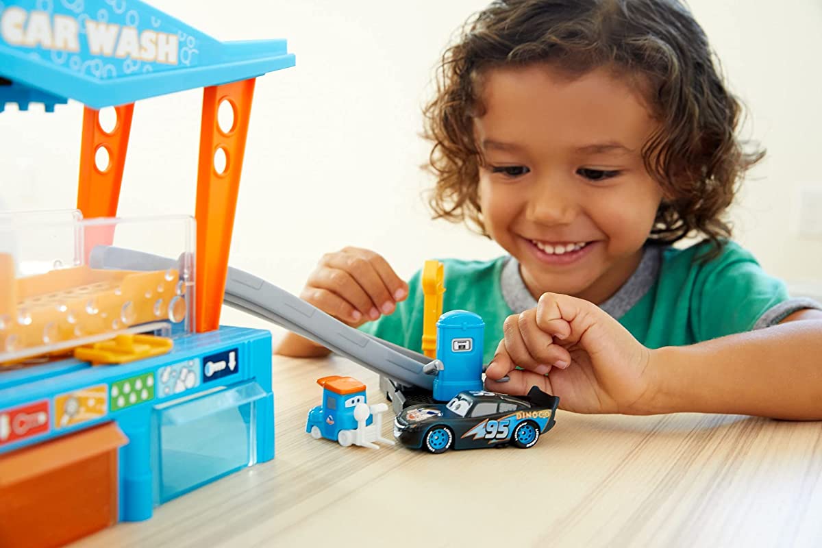 kid playing with a Disney Pixar car wash playset