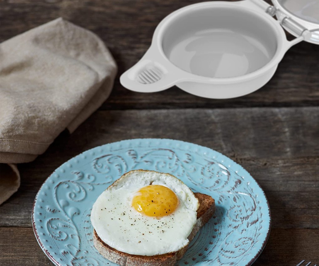 Chef Buddy Microwave Egg Maker next to sunny side up egg on toast