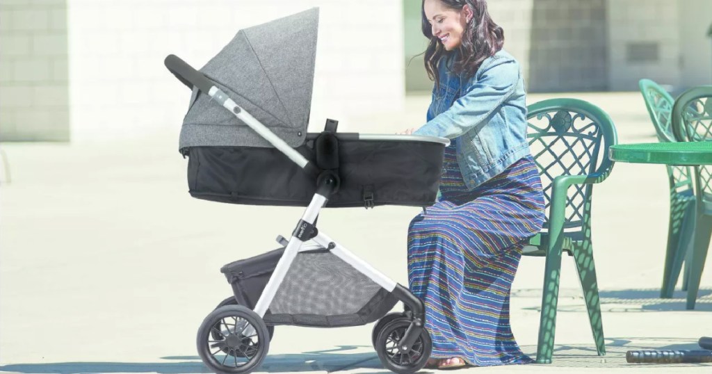 woman sitting in front of stroller 