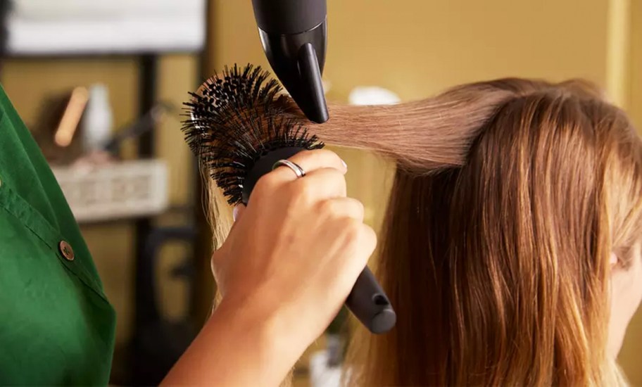 woman getting blowout at salon