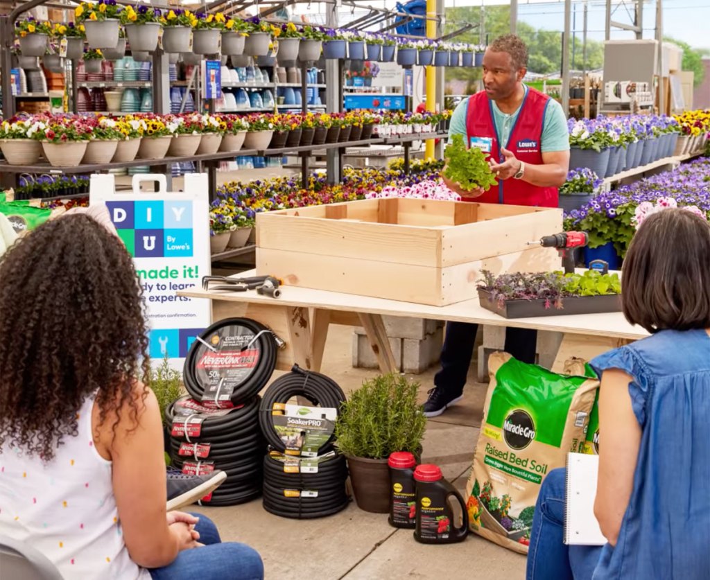 man teaching workshop in lowe's garden center