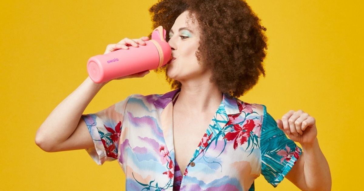 woman drinking from an Owala Water Bottle