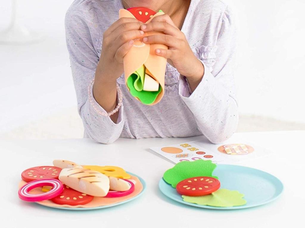 girl with skip hop play food meal kit set