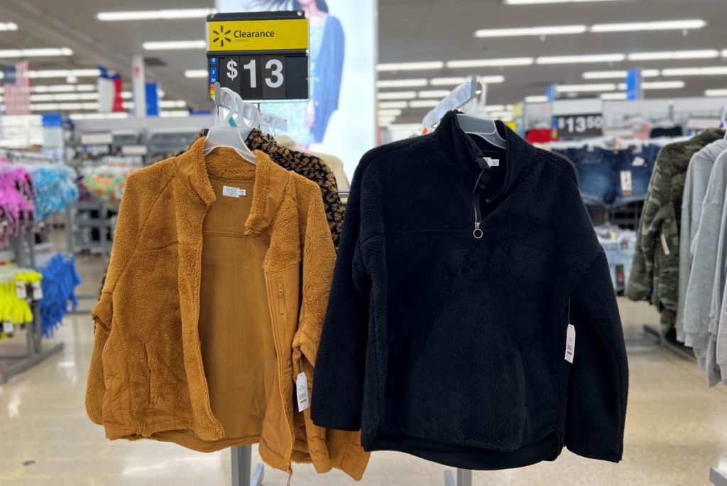 Time and Tru Sherpa jackets on hangers at Walmart