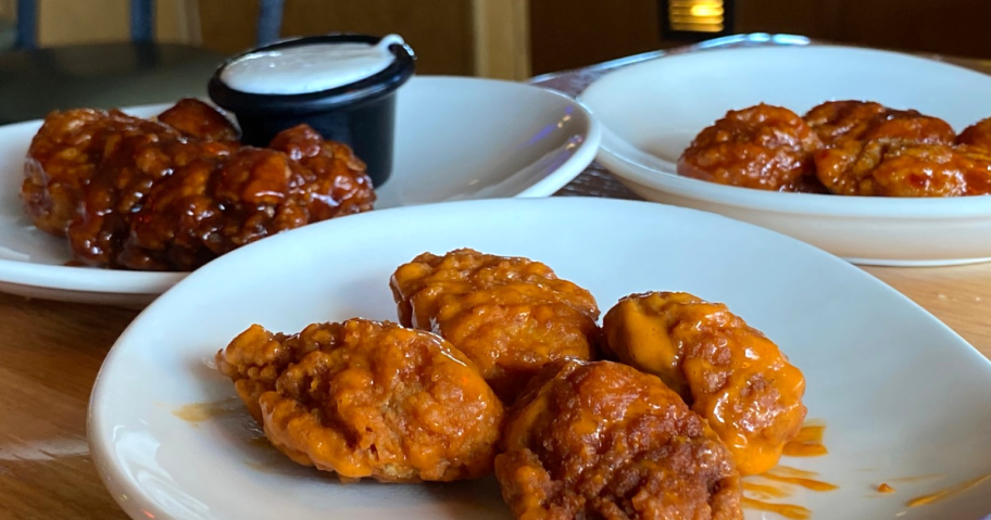 boneless chicken wings on white plates
