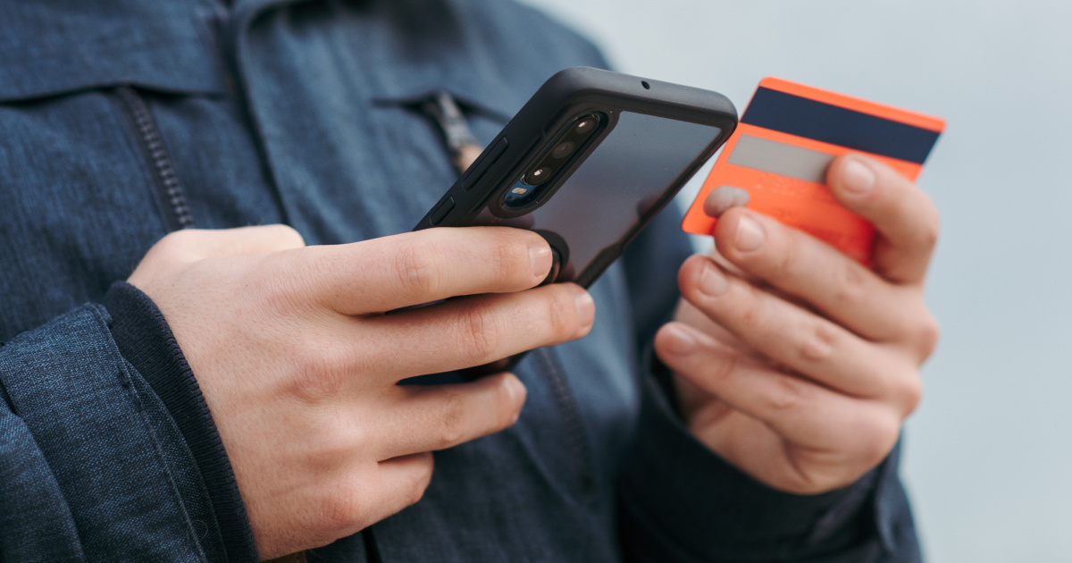 man on phone and credit card - chick-fil-a ordering hacks