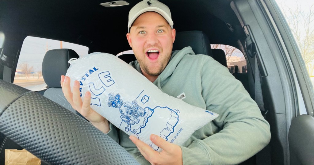 man holding a bag of ice