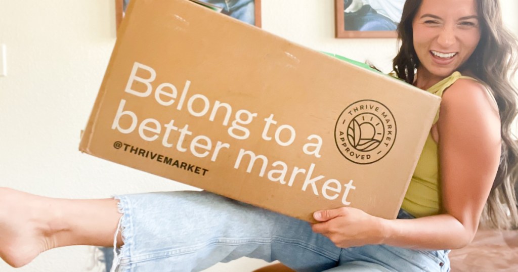 woman wth leg up holding box