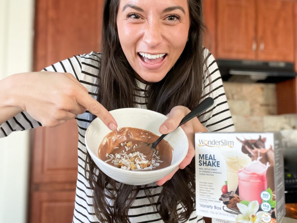 woman pointing at bowl of diet direct wonderslim pudding