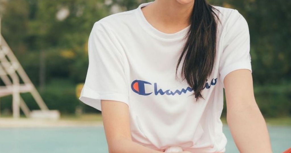 woman in a Champion tee