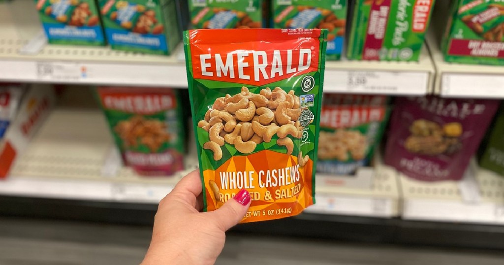 hand holding bag of cashews in store