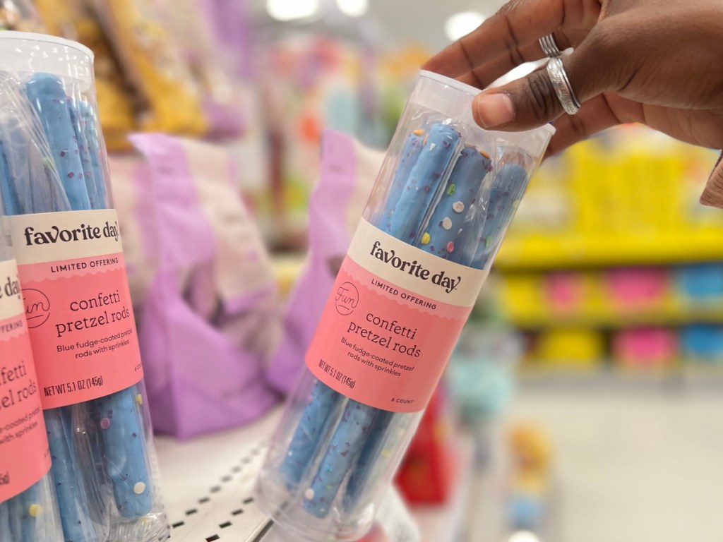 container of blue fudge dipped pretzel rods on store shelf