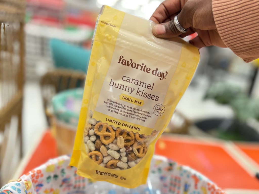 hand holding bag of trail mix in store