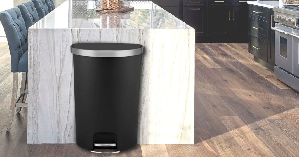 Better Homes & Gardens 14.5-gal Plastic Semi Round Kitchen Step Trash Can, Black shown in a kitchen