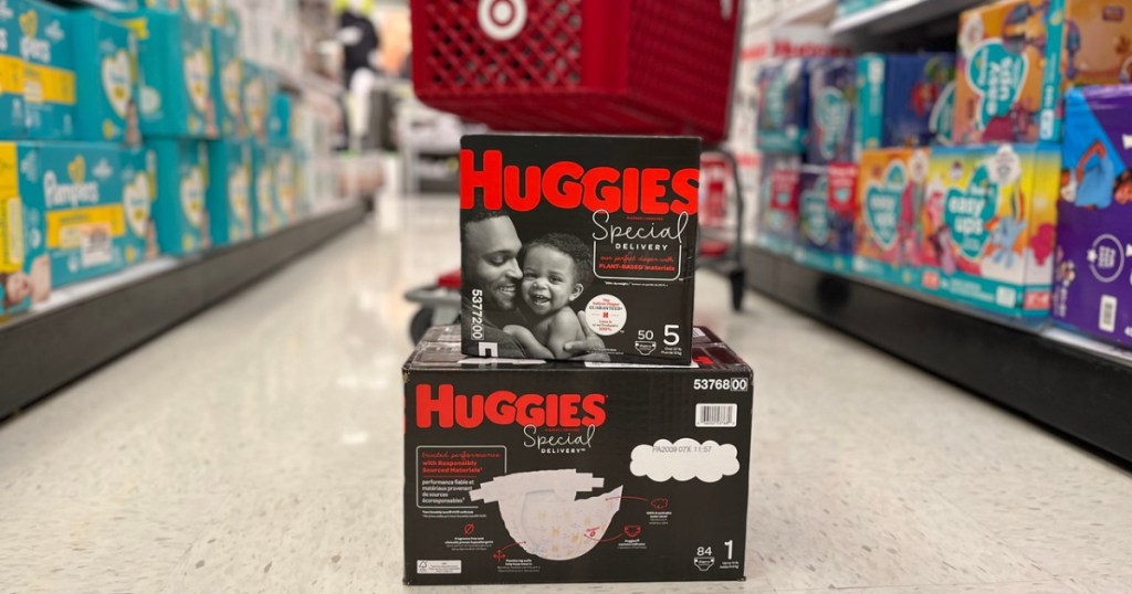 two boxes of Huggies Special Delivery Diapers in front of a Target cart