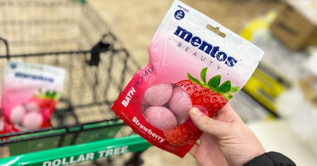 holding up pack of Mentos Bath Bombs