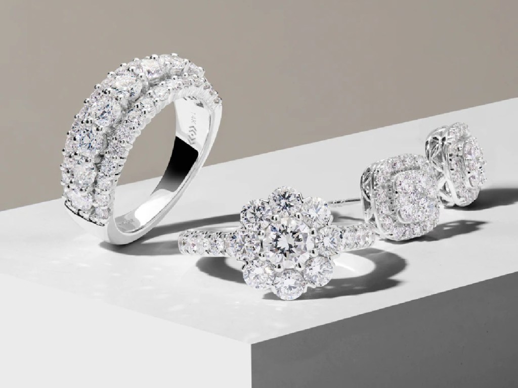 two diamond rings and pair of diamond earrings