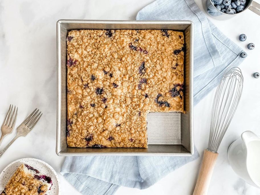 A USA Pan filled with a blueberry crumble