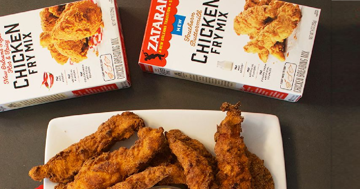 two boxes of chicken fry mix and plate of fried chicken