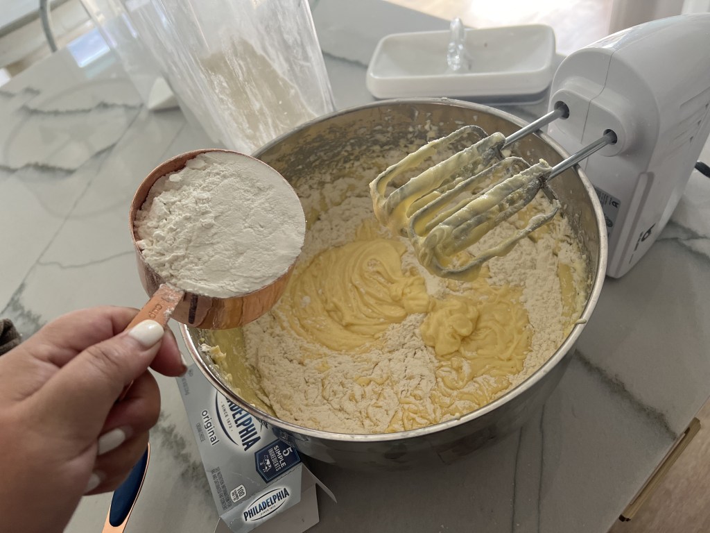 adding flour to pound cake