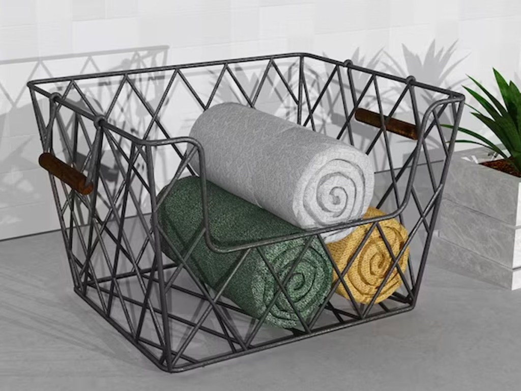 black iron basket with blankets