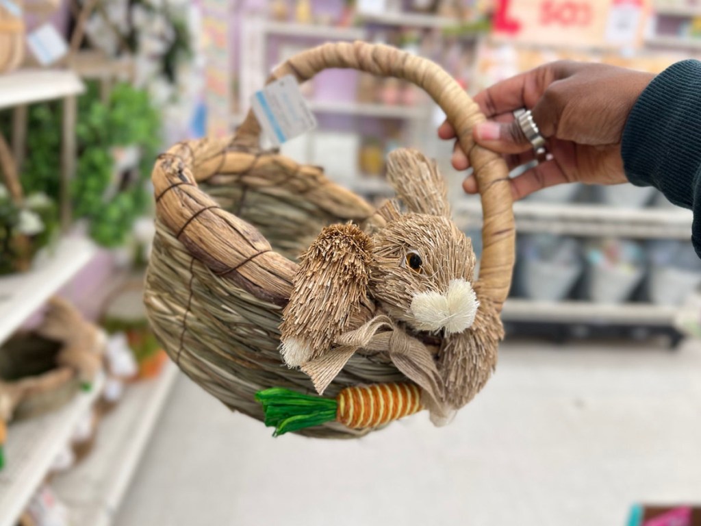 hand holding weaved easter basket with bunny