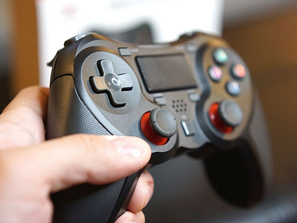 hand holding Terios Wireless Pro Controller